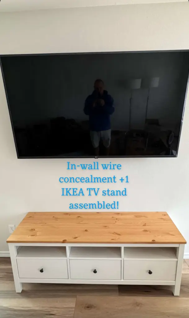 Wall mounted TV with in wall wire concealment installed above an assembled IKEA TV stand by ZehmTV in Washington State