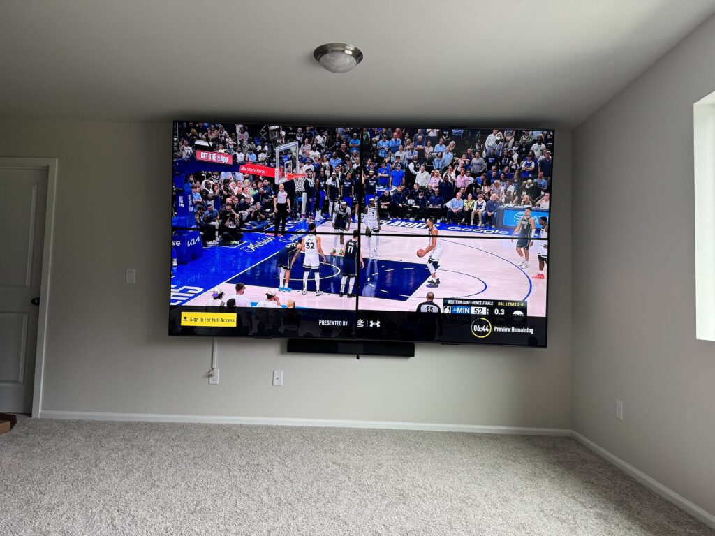2x2 video wall installation with four 65 inch TVs mounted by ZehmTV Mounting Services in Lacey, WA